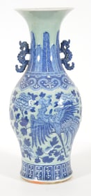 Porcelain vase. China. 19th century. Baluster form with kui dragon handles. Relief underglaze blue