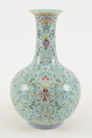 Porcelain vase. China. Late 19th century. Bottle form. Pale turquoise glaze with famille rose