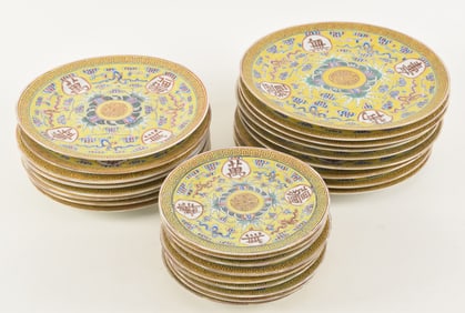 Porcelain plates. China. Yellow ground with auspicious symbols and clouds. Kuang Hsu mark. 9 plates