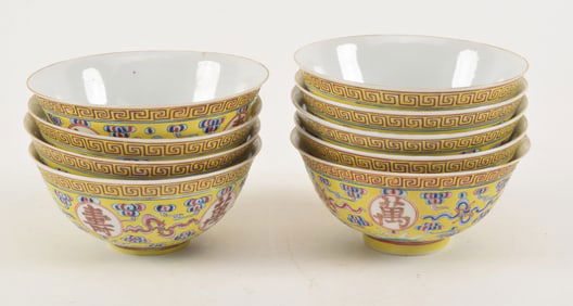 Porcelain bowls. China. Yellow ground decorated with auspicious symbols and clouds. Kuang Hsu marks.