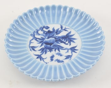 Porcelain dish. China. 20th century. Molded in the form of an open chrysanthemum with a pale blue