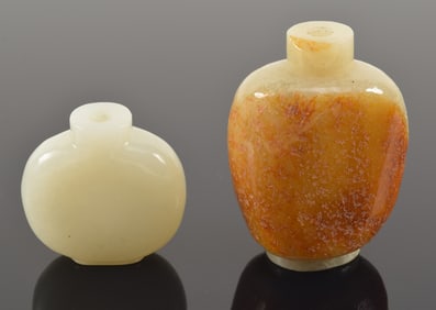 2 jades. China. 19th/20th century. A plume holder and chin-lute shaped. Each about 3.25in.