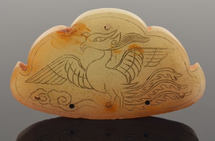 Jade phoenix engraved pendant. China. Liao period (916-1125). 2.5in length.