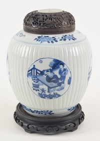 Porcelain jar. China. 19th century. Ribbed body with underglaze blue borders and jade inset cover.