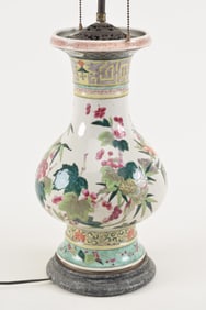 Porcelain vase. China. 19th century. Hu form. Famille rose decoration of flowers and butterflies.