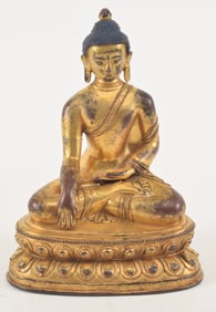 Gilt bronze buddha. Sino-Tibetan. 18th century. Shakyamuni in the earth witnessing mudra. 7.25in