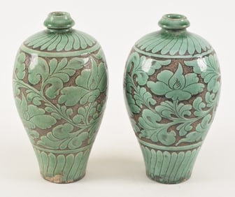Pair of Cizhou plum vases. Carved out floral decoration and glazed in soft green enamel. 10in high.