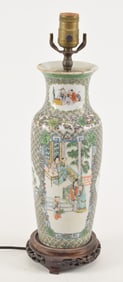 Porcelain vase. China. 19th century. Brocade borders with famille verte room interiors with figures.