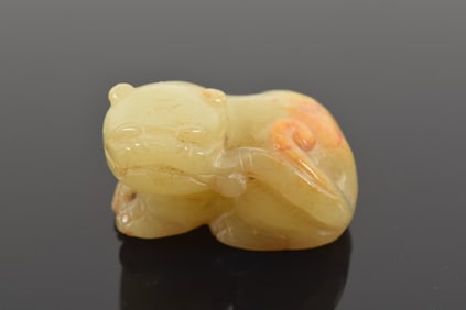 Jade animal. China. 19th century. Russet marked stone carved as a foo dog. 1.5in.