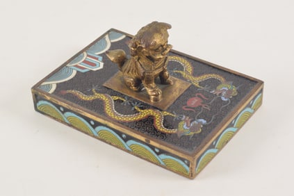 Cloisonne paperweight. China. Early 20th century. Decoration of dragons on a black ground. Dragon