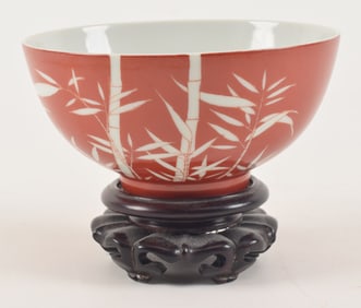 Porcelain bowl. China. Kuang Hsu mark and probably of the period. Iron red ground with silhouette