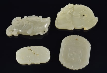 4 Jade pendants. China. 19th/20th century. Celadon stone. To include: fish, horse and 2 pendants.