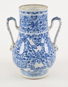 Porcelain handled jar. China. Kang Hsi period (1662-1722). Underglaze blue floral scrolls. Drilled