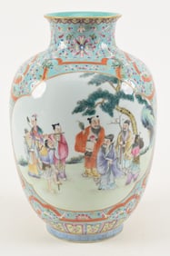 Porcelain vase. China. Early 20th century. Famille rose scenes of the immortals on a flower strewn