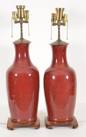 Pair of oxblood vases. China. Early 20th century. Drilled and mounted as lamps. Overall height:
