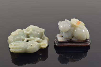 2 jade carvings. China. 20th century. To include a 3 fruits group and a cat with a butterfly. 4in.