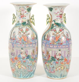 Pair of famille rose vases. China. Early 20th century. Baluster form with ribbon handles. Historical