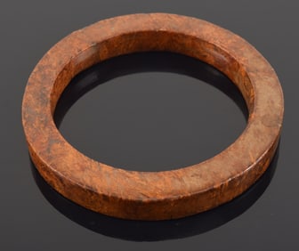 Archaic ritual jade. Huan of brown jade. 3.5in diameter.