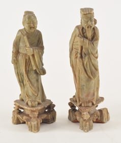 Pair of soapstone figures. China. 19th/20th century. Finely carved Daoist immortals He Xiangu and Li