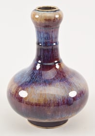 Flambe porcelain vase. China. 19th/20th century. Garlic mouth type. Oxblood glaze with sections of