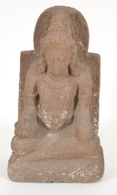 Carved volcanic stone. Indonesia. 20th century or earlier. Seated image of a divinity. 20 x 10in.