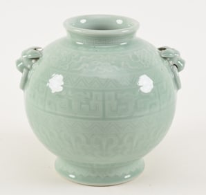 Porcelain vase. China. 20th century. Hu form. Animal mask faux jump rings. Carved archaic decoration