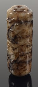 Jade tube pendant. China. Ming period (1368-1644). Black stone carved with chih lung. 2.5in.