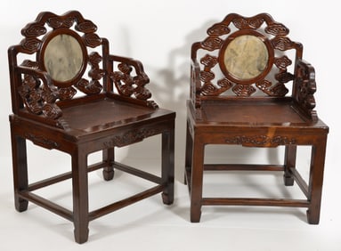 Pair of carved rosewood armchairs. China. Late 19th century. Inset with marble backs. Carved with