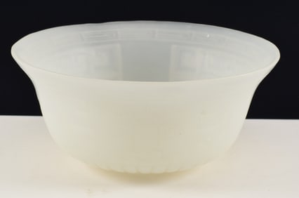 Peking glass bowl. China. 19th/20th century. White color. Decorated with archaic carved tao tieh