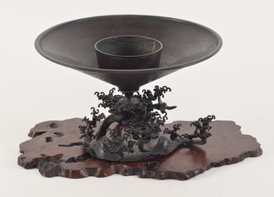 Flower vase and stand. Japan. Early 20th century. Bronze with a wave form base. Signed. Burlwood
