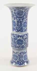 Porcelain beaker vase. China. 19th/20th century. Blue and white stylized floral scrolling. 17.5in