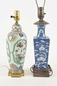 [2] lamps. A prunus vase of square form and a Samson famille verte covered jar with heavy bronze