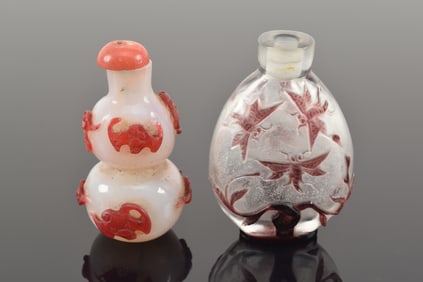 2 snuff bottles. China. 19th/20th century. Overlay glass (one double gourd shaped). Each about 3in.
