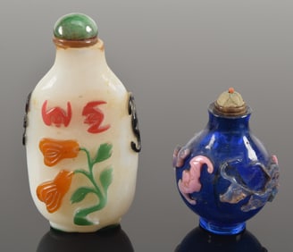 2 snuff bottles. China. 19th century. Overlay glass on white and on blue. Each about 3in.
