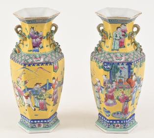 Pair of porcelain vases. China. 19th century. Hexagonal form with peach bough handles. Famille verte