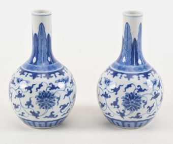 Pair of porcelain vases. China. 20th century. Underglaze blue stylized lotus scrolls. Chien Lung