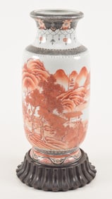 Porcelain vase. China. Early 20th century. Rouleau form. Iron red landscape decoration with brocade