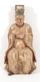Carved wooden figure of a deity. China. 18th century. Seated figure in court costume. 36in high.