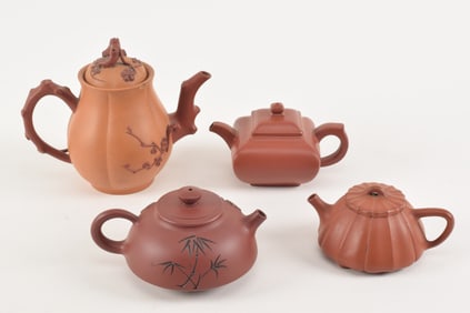 [4] Yi Hsing teapots. China. 20th century. Largest 7.5in.
