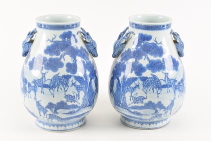 Pair of porcelain vases. China. 19th/20th century. Hundred deer decoration. Deer head handles. Base