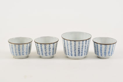 4 porcelain cups. China. 19th century. Export ware to southeast Asia. Inscriptions in underglaze