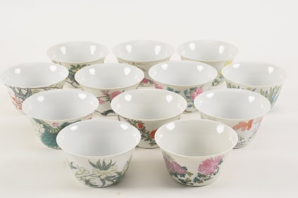 12 porcelain cups. China. 20th century. "Month" cups. Finely painted with seasonal flowers. 4in