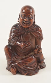 Carved wooden Luo Han. China. 19th century. 3.5in high.