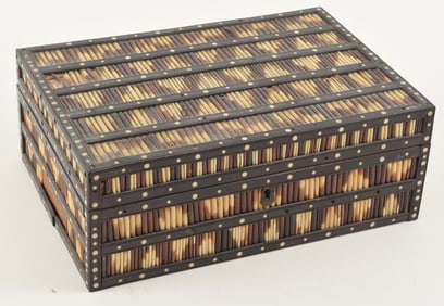 Anglo-Indian box. 19th century. Paduk wood, bone, and porcupine quills. Fitted interior. Losses.