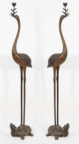 Pair of bronze floor prickets. China. 20th century. Cranes with tortoise bases and patterned