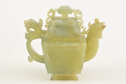 Bowenite ewer. China. 20th century. Carved spout and handle.