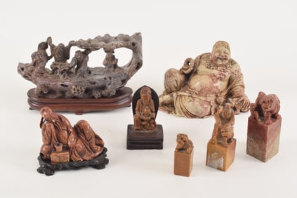 Lot of 7 soapstone carvings. China. 19th century. To include: liu hai, kuan yin, a ship with the