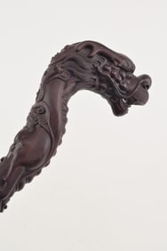Hung mu carved dragon head walking stick. China. 20th century.