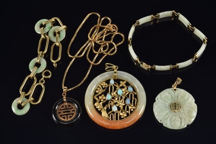 14K gold jade mounted jewelry. To include: chain link bracelet with jade discs, ring disc set with