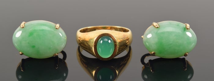 3 pieces of gold jade mounted jewelry. Ring set with an oval cabochon and a pair of earrings with